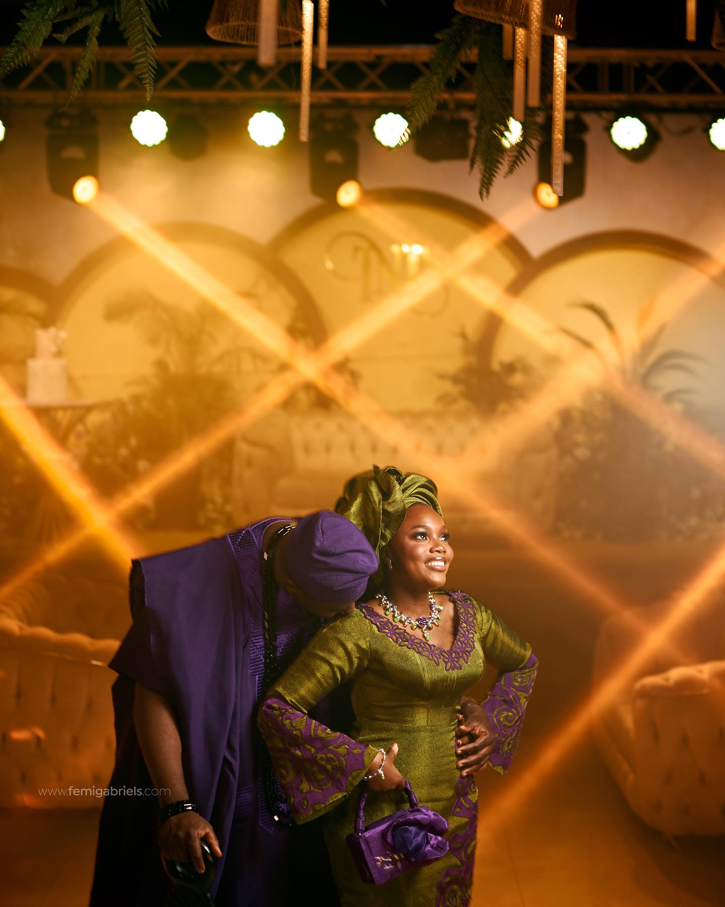 Couple in traditional attire at a wedding reception